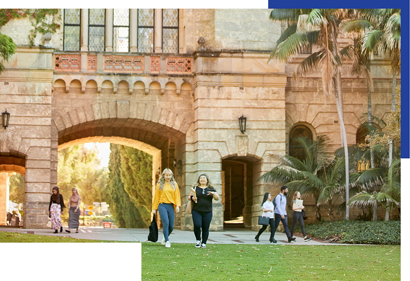 Two students walking and talking outside Winthrop Hall